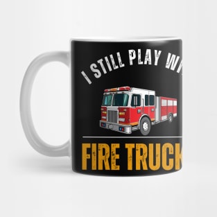 I Still Play With Fire Trucks Mug